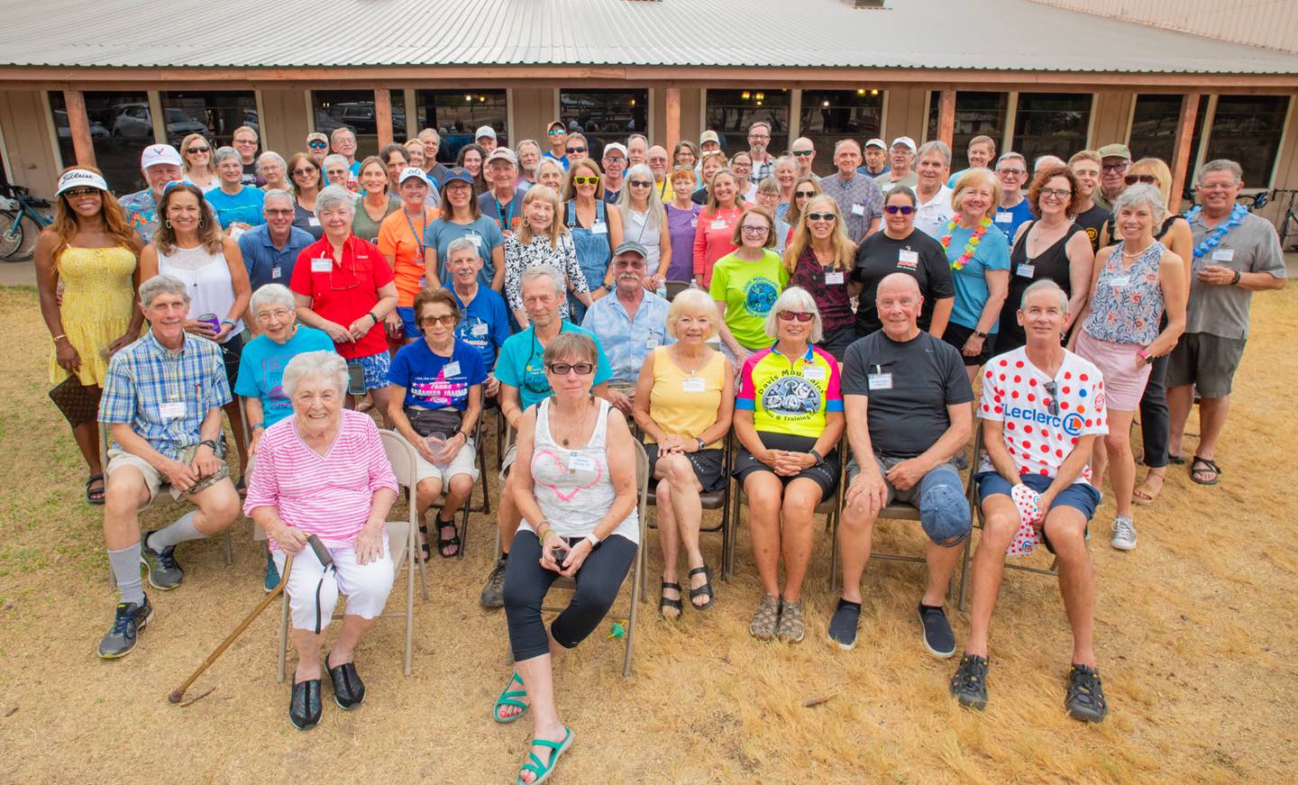 About a hundred campers of all ages gathered for a group photo in front of the ranch dining hall